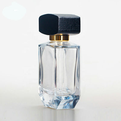 Garrafa de perfume de vidro vazia com o tampão preto de madeira do collarwith do pulverizador do tampão e da bomba