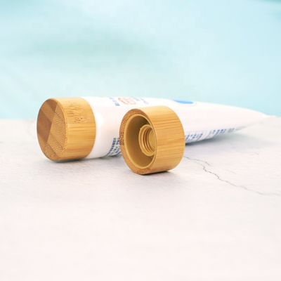 Tampão de bambu cosmético feito sob encomenda de venda quente da tampa de bambu do tampão de parafuso ISO2000 para o tubo