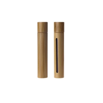 Garrafa de vidro cosmética natural do óleo essencial com o rolo de bambu real do metal do tampão